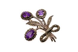 An amethyst and silver bouquet brooch. With marcasite details, hallmarked verso, 4.6cm x 3.