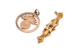 A Victorian gold stone set bar brooch a metal pendant.