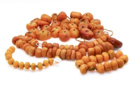 A quantity of assorted amber beads. Various sizes and colours, all drilled, largest circa 3.