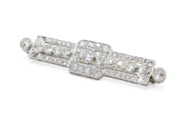 A diamond set panel brooch in the Art Deco style.
