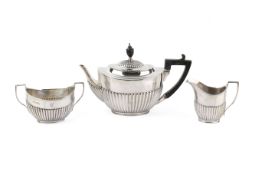 A circa 1900 matched three-piece silver tea service.