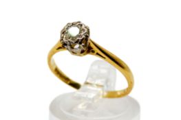 An 18ct gold and diamond solitaire ring. The illusion set stone circa 0.