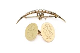 A yellow metal crescent brooch and a single cufflink.
