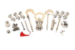 A small group of silver and white metal collectables.