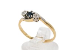 An 18ct gold three stone ring.