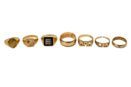 Seven hallmarked 9ct gold rings. Various forms, one set with a black panel, gross weight 33.8g.