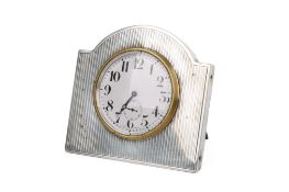 An Art Deco silver mounted easel-back desk clock.