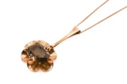 A Finnish 9ct gold and smoky quartz pendant and chain by Nina Breddal.