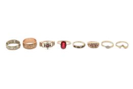 Eight assorted 9ct gold rings.