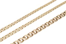 A yellow metal double loop necklace and matching bracelet.