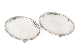 A pair of early 19th century oval silver salvers.