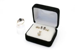 A 9ct gold ring, a pendant, and two pairs of small diamond earrings.