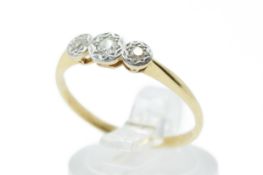 An 18ct gold three stone ring.