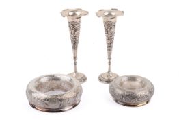 A pair of white metal Malaysian posy rings and a pair of Middle Eastern vases.