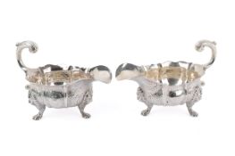 A pair of mid-18th century John Pollock sauce boats.