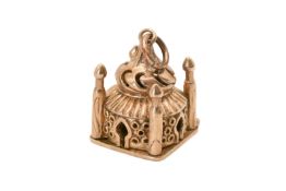A 9ct gold charm pendant in the form of a Persian temple.