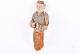A Chinese painted wood funerary figure.