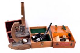A Leitz camera Lucida microscope attachment and a group of microscopes parts and attachments.
