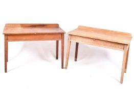 A pair of vintage pine work tables.