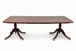 A Regency style mahogany extending dining table.