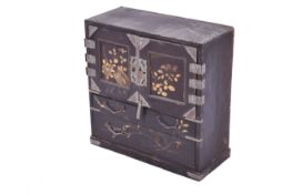 A vintage Japanese black lacquer jewellery box. White metal engraved hinges and gilt decoration.
