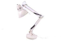 JLP multi-poise desk lamp. Raised on a circular base.