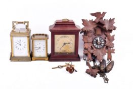 A group of four assorted clocks (af).