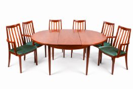 A mid-20th century G-plan Fresco teak table and six chairs. Extending, oval table on tapering legs.