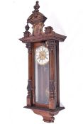A Viennese style pendulum wall clock with mahogany case. Key present.