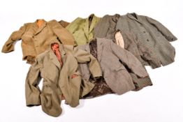 A quantity of assorted vintage gentlemen's wool jackets, mostly tweed or dog tooth material.