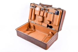 Gentleman's leather travelling case having silver mounted glass requisites.