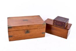 A mahogany writing slope and two other wooden boxes.