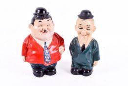 A pair of vintage plaster 'Laurel and Hardy' money box banks.