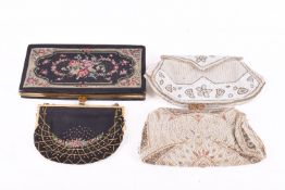 A group of four vintage women's evening clutch purses. Including two bead work examples, etc.