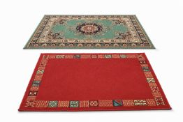 Two modern rugs - one red and the other on a green ground.