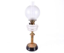 A late 19th early 20th Century brass oil lamp with and etched shade.