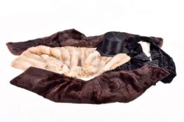 A collection of vintage women's furs and others. Including a jacket and a silk top hat.