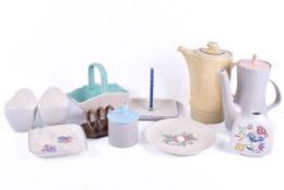 A collection of assorted mid-century Poole pottery items. Including two coffee pots, etc.