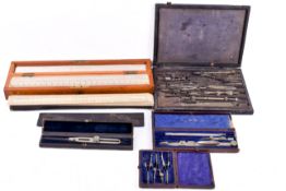 A collection of assorted draughtman's drawing sets, rules etc. Mostly cased.