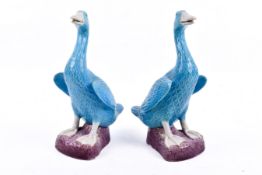 Two mid-century Chinese porcelain figurines modelled as ducks with turquoise glaze.