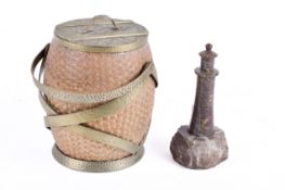 A turned serpentine stone lighthouse and a Doulton Lambeth stoneware biscuit barrel. Largest H17cm.