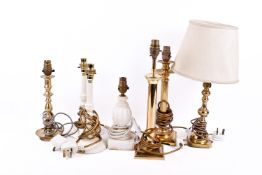 A collection of assorted table lamps, mostly brass.