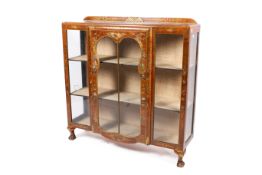 A 1920s mahogany breakfront display cabinet with chinoiserie decoration.
