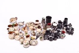 A quantity of assorted Devon pottery motto ware, Prinknash pottery and Fishley Holland wares.