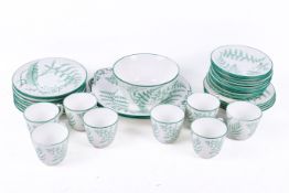 A green fern tea set, mostly for eight. Including plates, cups and saucers.