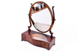 A Georgian inlaid mahogany dress mirror (af). Having three drawers and raised on bracket feet.