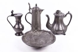 A group of four assorted items of pewter. Including a tea pot and an art nouveau footed dish, etc.
