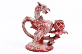 A 19th century Cantagalli Italian Faience candlestick, in the form of a griffin (af). H17.