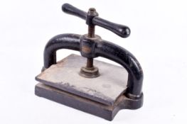 A vintage wrought iron book press.