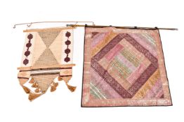 Two wall hangings.